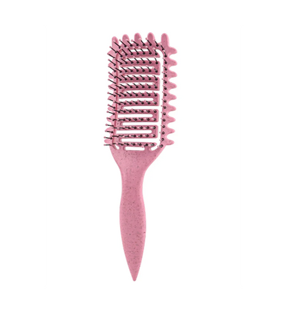 Brosse Curly rose avec poils flexibles et design creux, signée Bouclettes Rebelles, idéale pour démêler et définir les cheveux bouclés, frisés et crépus parfait pour les routines